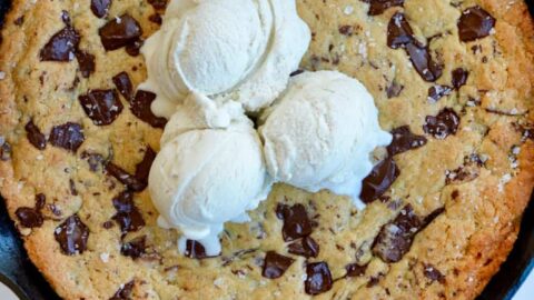 Top down view of The Ultimate Skillet Chocolate Chip Cookie topped with vanilla bean ice cream