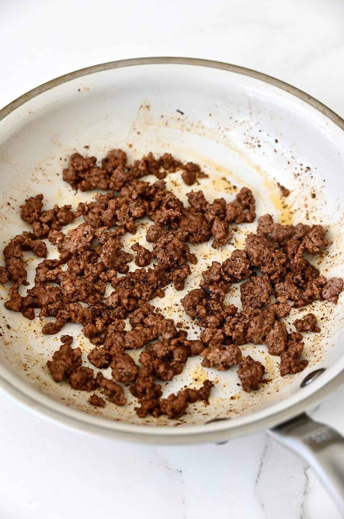 Cooked taco meat in a large skillet.