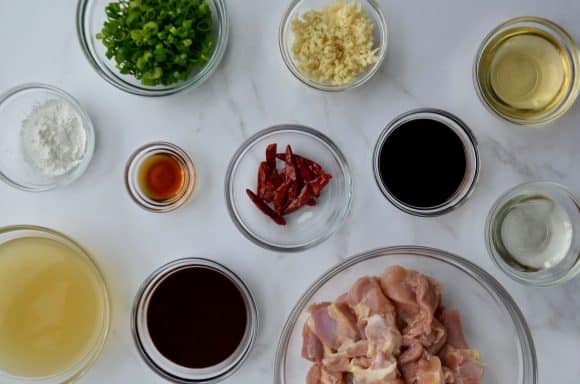 Small and medium glass bowls containing general tso's chicken ingredients