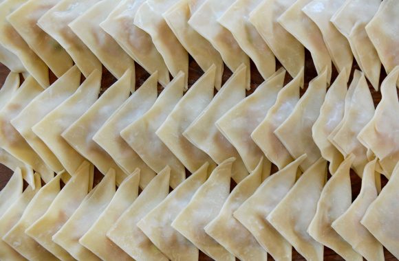 Three rows of triangle-shaped wontons