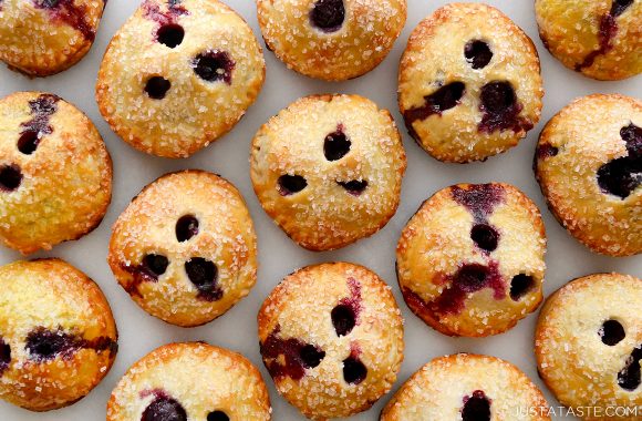 A close-up of blueberry hand pies on a white background