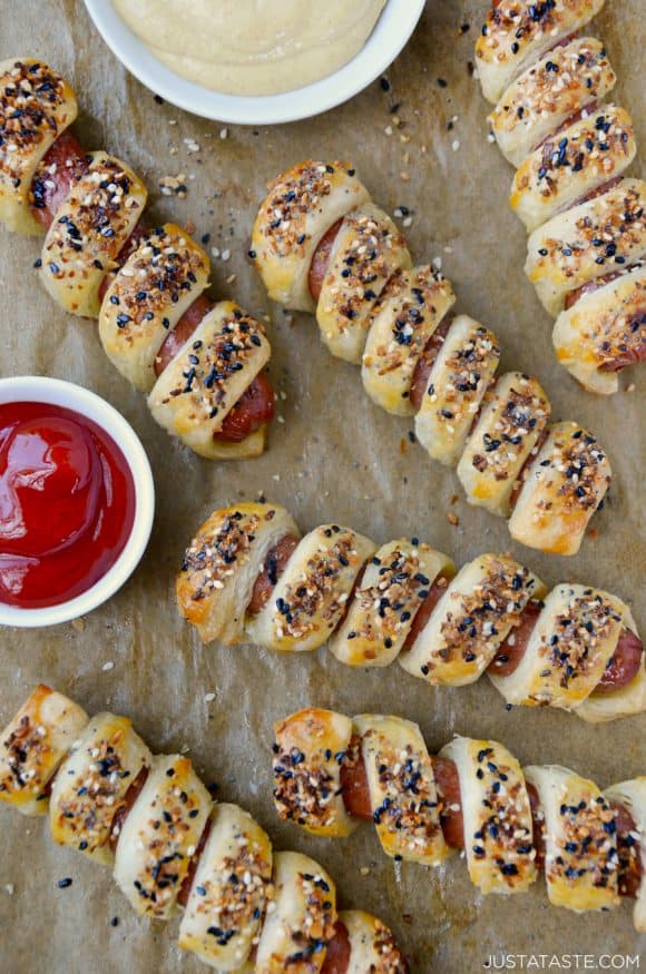 Everything Puff Pastry Pigs In a Blanket on parchment paper