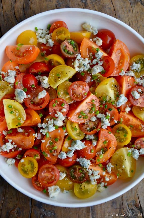 Top down view of Steakhouse Tomato Salad with Blue Cheese and chives