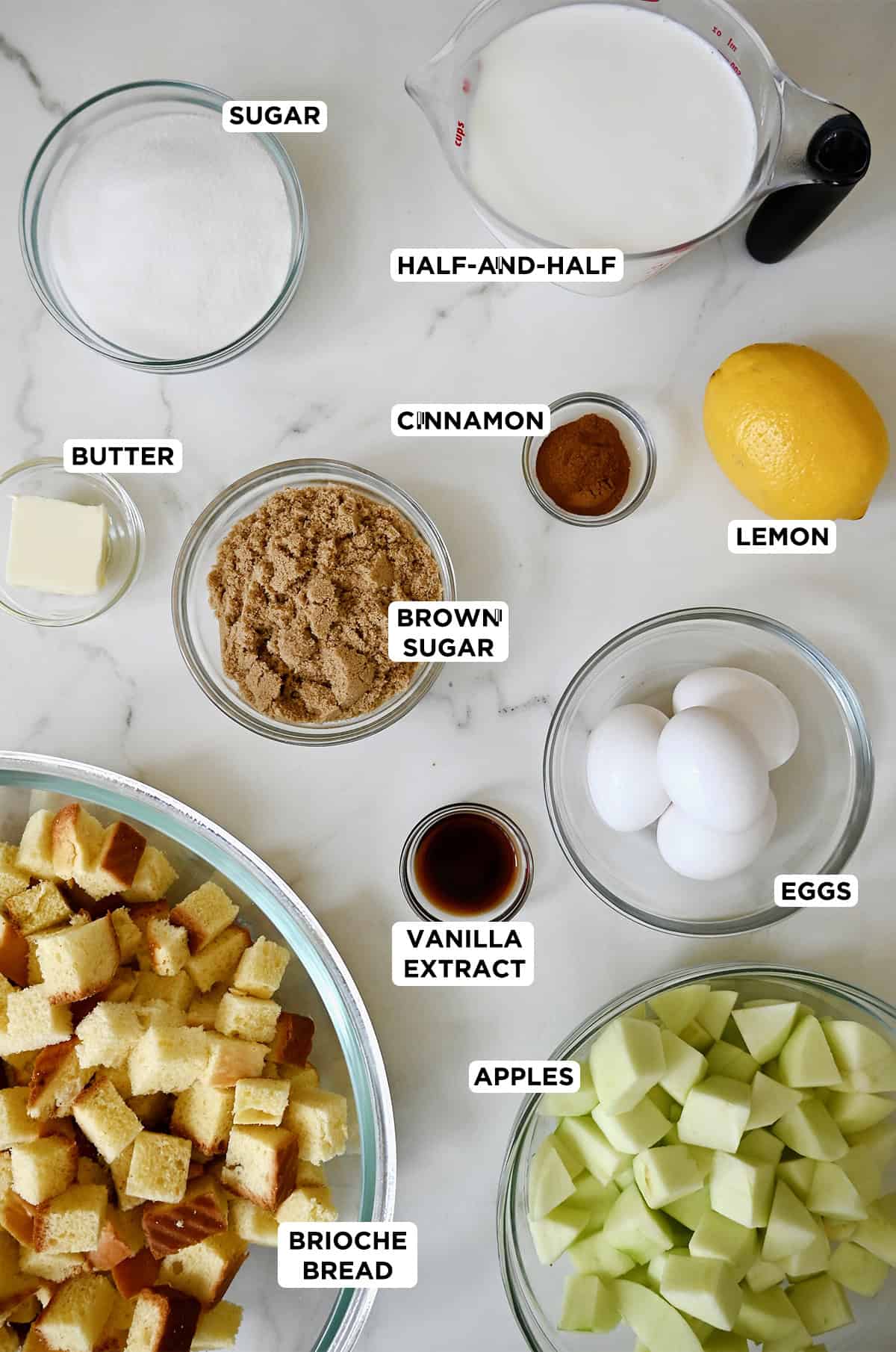 Ingredients to make bread pudding with diced apples.