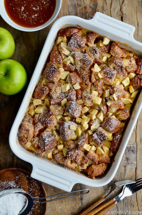 A white serving dish containing freshly baked Caramel Apple Bread Pudding