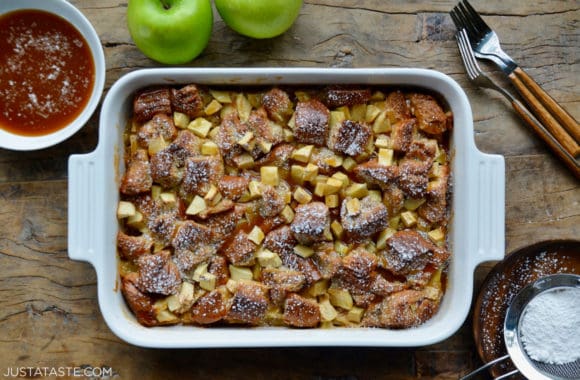 A white baking dish containing Caramel Apple Bread Pudding