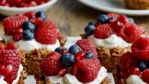 Muffin Tin Granola Cups topped with yogurt and fresh fruit