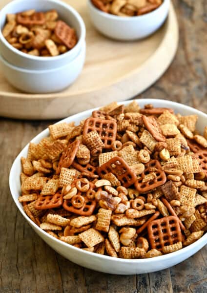 Homemade Chex Mix in a white serving bowl.