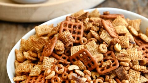 Homemade Chex Mix in a white serving bowl.