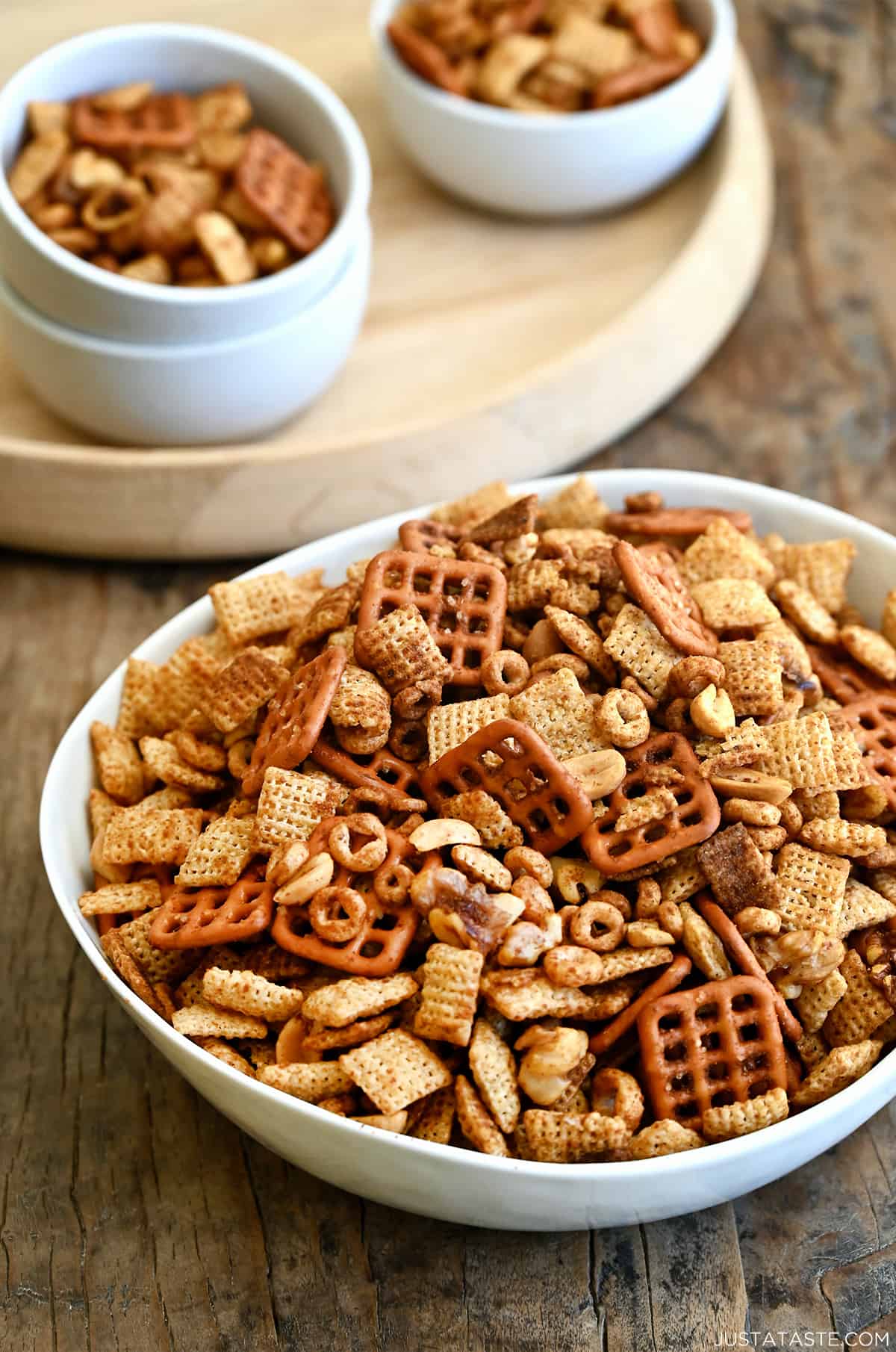 Homemade Chex Mix in a white serving bowl.