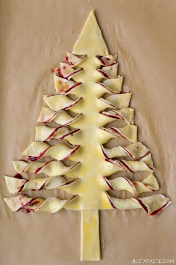 Puff pastry Christmas tree on parchment paper lined baking sheet