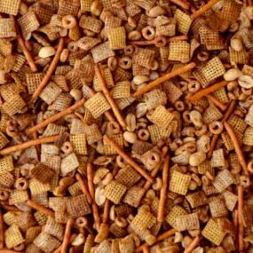 Closeup view of Homemade Chex Mix with pretzels and mixed nuts