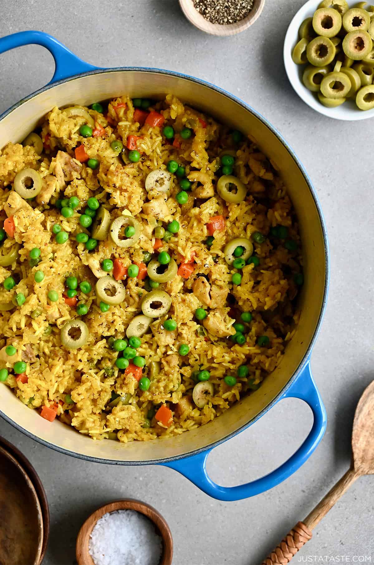 Chicken yellow rice and veggies in a Dutch oven.