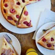 " A top-down view of a Cream Cheese Coffee Cake studded with fresh raspberries."