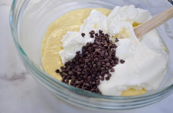 Ricotta pancake batter with chocolate chips in a glass bowl
