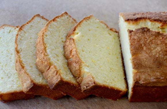 Sliced pound cake on wooden cutting board