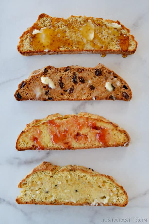 Four slices of bread topped with different toppings