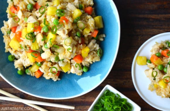 Pineapple Chicken Fried Rice in blue bowl next to chopsticks 