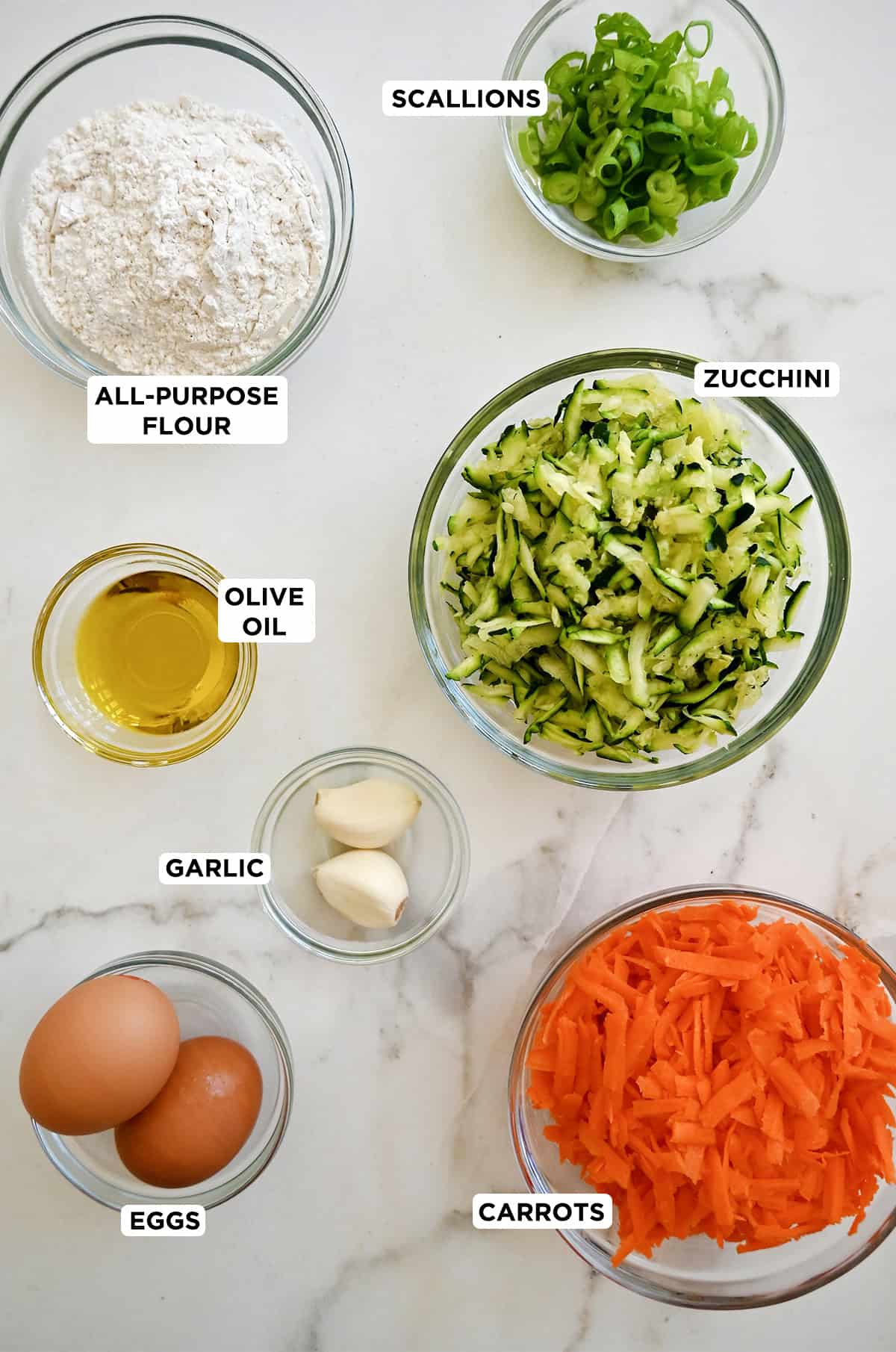 Ingredients to make carrot and zucchini fritters.