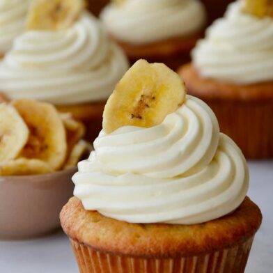 Banana Cupcakes with Cream Cheese Frosting topped with a banana chip