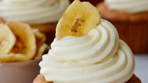 Banana Cupcakes with Cream Cheese Frosting topped with a banana chip