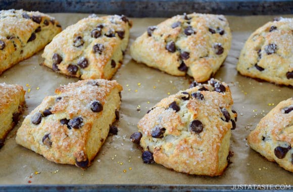 Homemade Sour Cream Chocolate Chip Scones on parchment paper-lined baking sheet