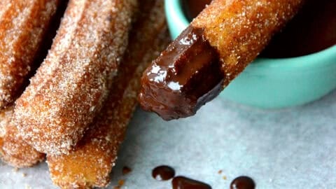 Easy Homemade Churros dipped in chocolate sauce.