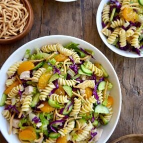 Top down view of bowl containing Chinese Chicken Pasta Salad with Sesame Dressing