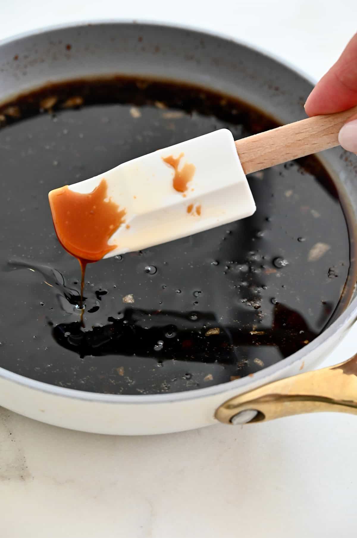 Homemade sesame chicken sauce in a saucepan.