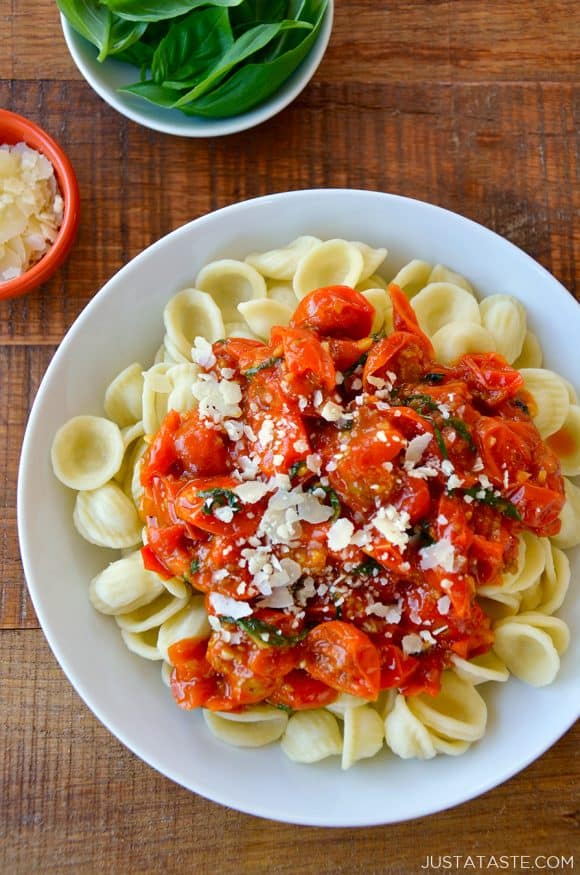 Top down view of quick cherry tomato pasta sauce over orecchiette