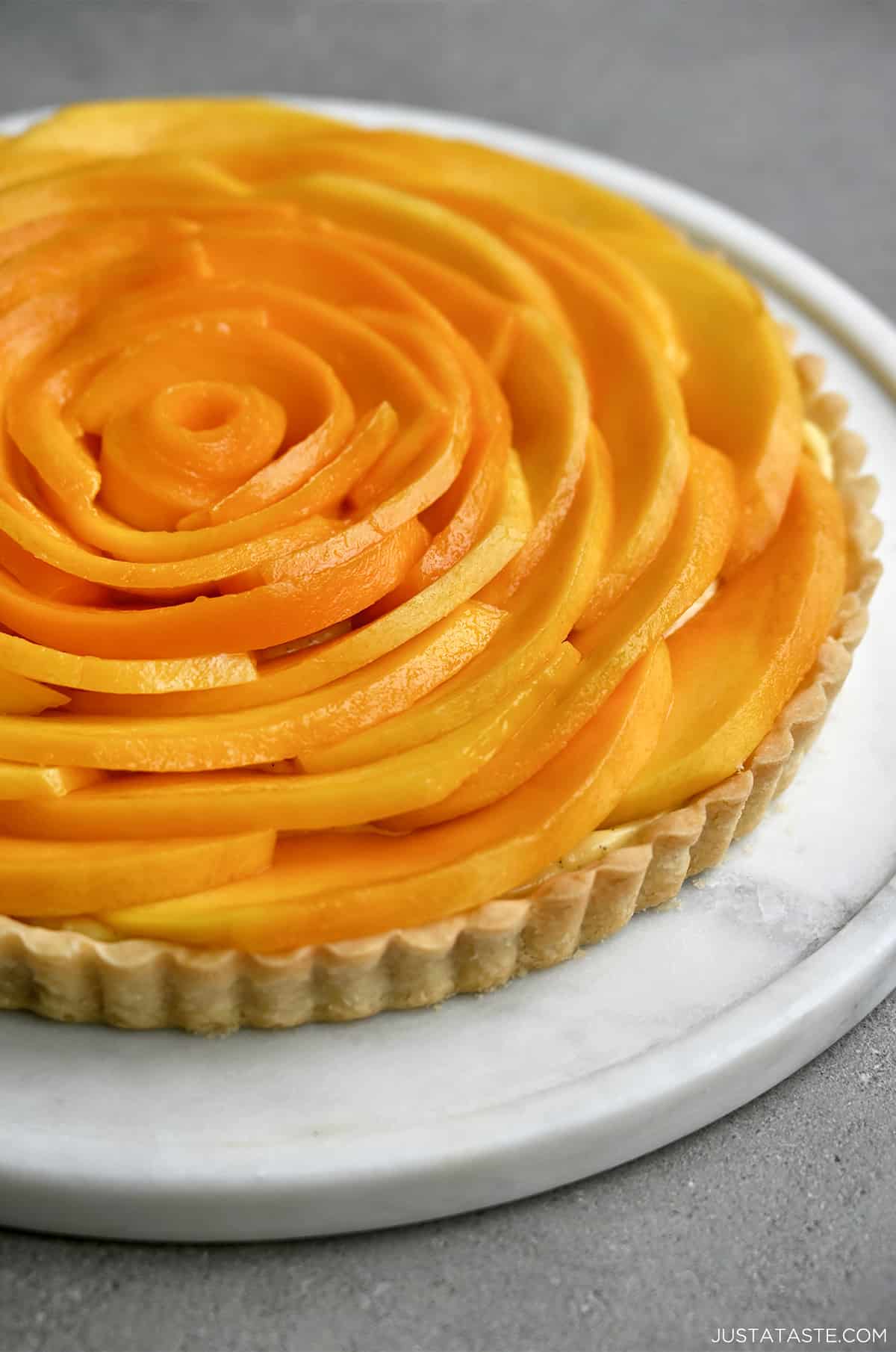 A mango tart with vanilla pastry cream.