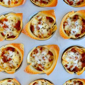 Muffin Tin Lasagna Cups topped with mozzarella cheese