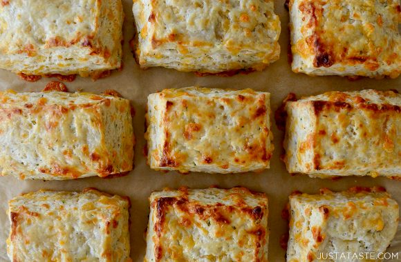 Top down view of the best cheddar biscuits in rows on baking sheet