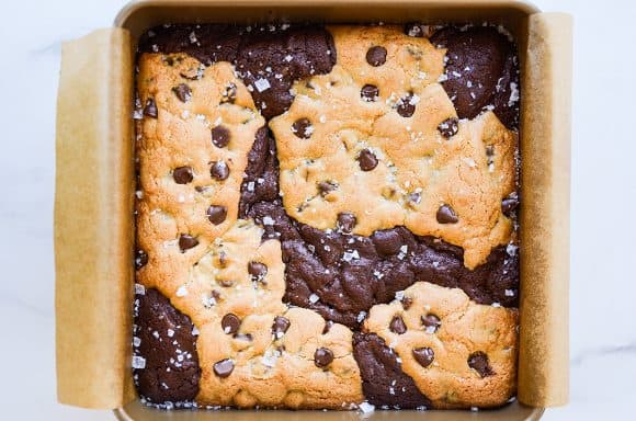 Baked chocolate chip cookie brownie bars in square baking dish