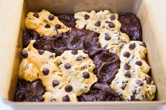 Unbaked brooks in parchment paper-lined baking pan