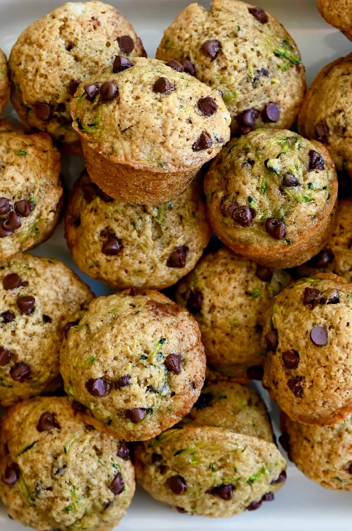 Mini zucchini muffins studded with mini chocolate chips.