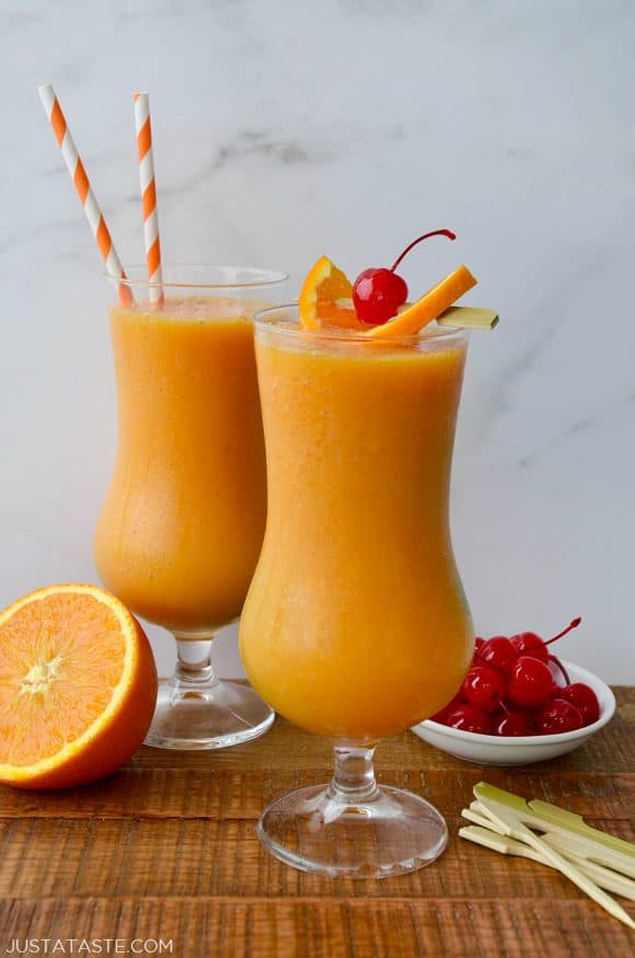 Virgin orange and mango slushies topped with cherries