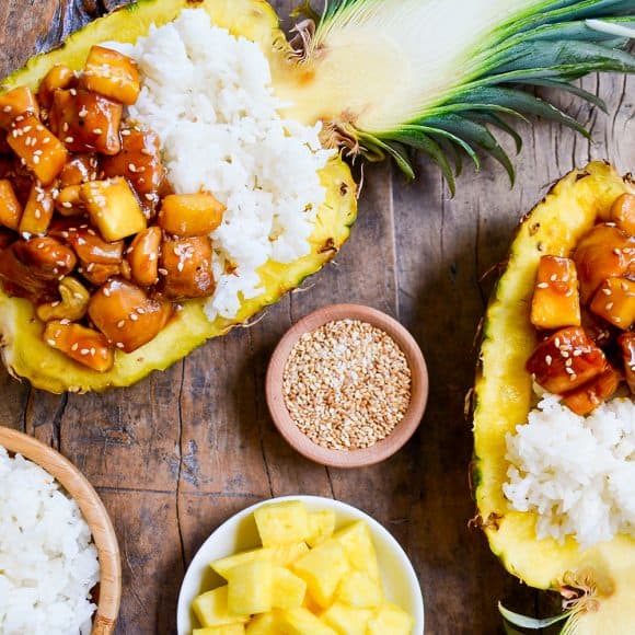 Pineapple boats filled with chicken and white rice