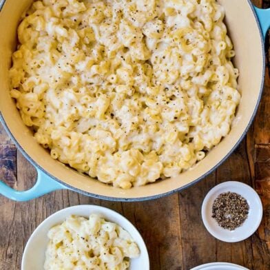 Top down view of stockpot and bowl with 30-Minute White Cheddar Mac and Cheese