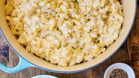 Top down view of stockpot and bowl with 30-Minute White Cheddar Mac and Cheese
