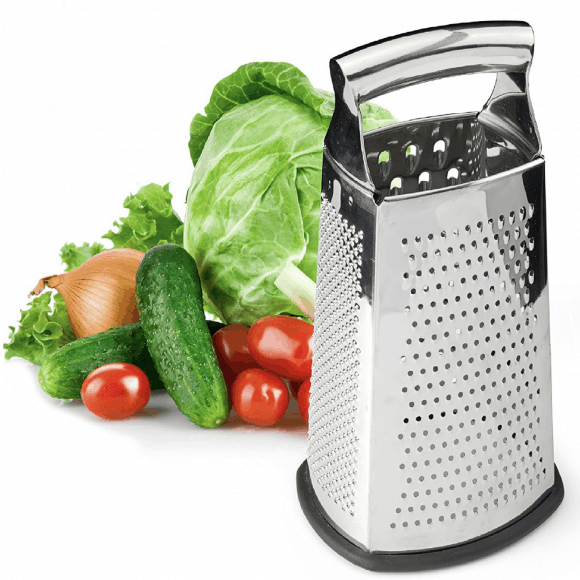 A box grater surrounded by vegetables