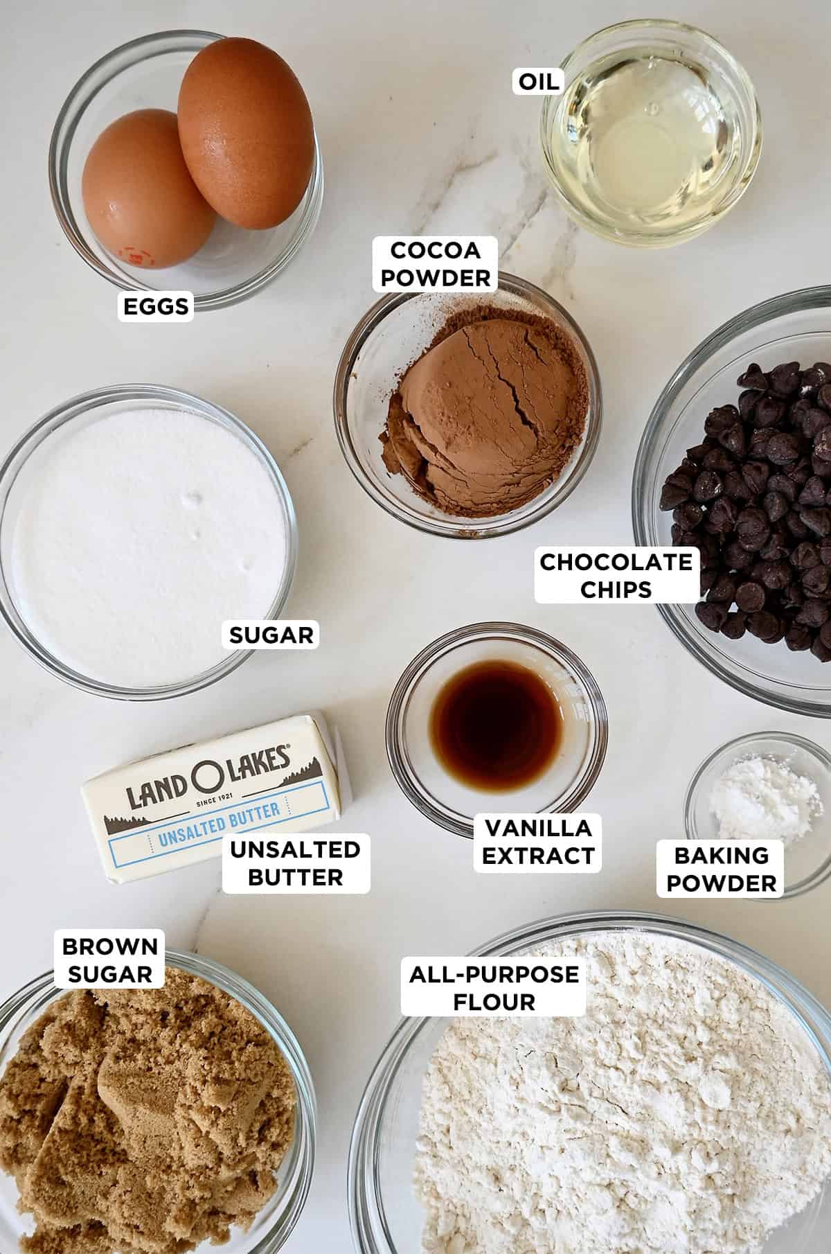 Ingredients to make brookies in various sizes of glass bowls.