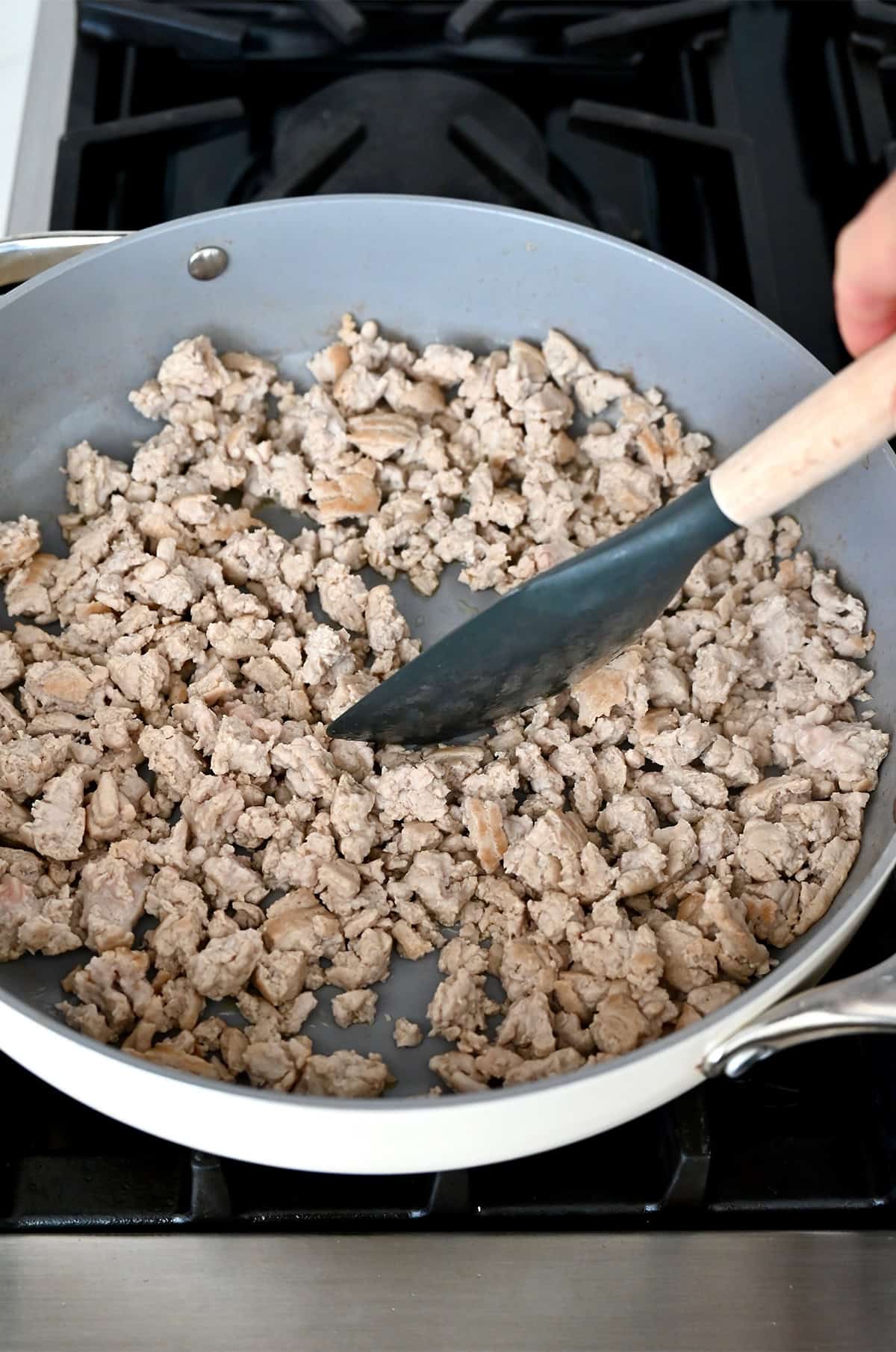 Browning ground turkey in a large skillet.