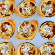 Muffin Tin Lasagna Cups topped with mozzarella cheese.
