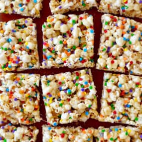 Squares of Funfetti Marshmallow Popcorn Treats.