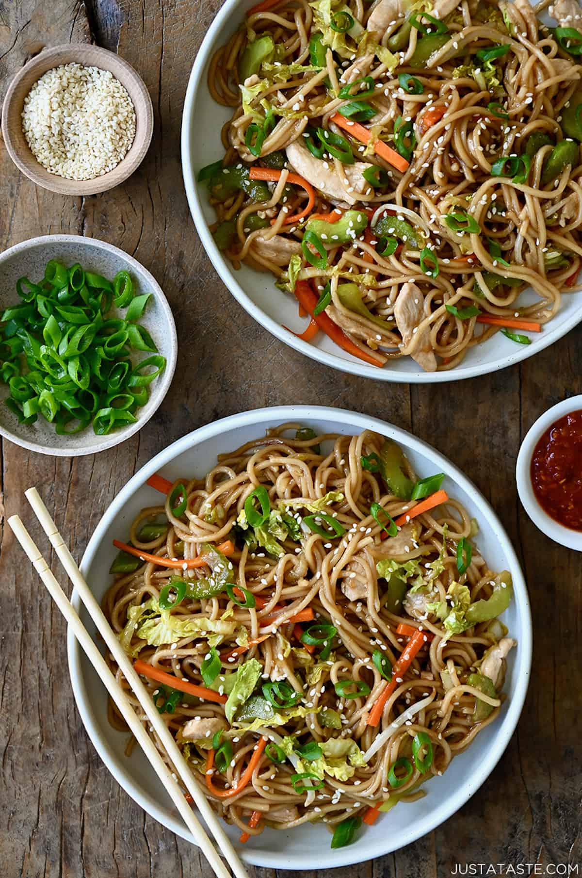 A top-down view of two bowls containing Quick Chicken Chow Mein and chopsticks.