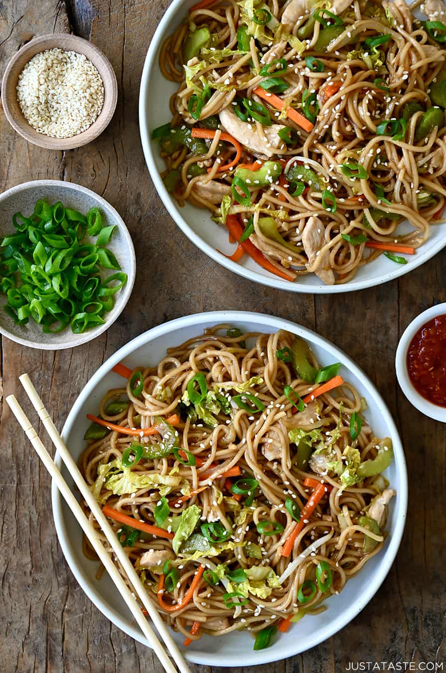 A top-down view of two bowls containing Quick Chicken Chow Mein and chopsticks