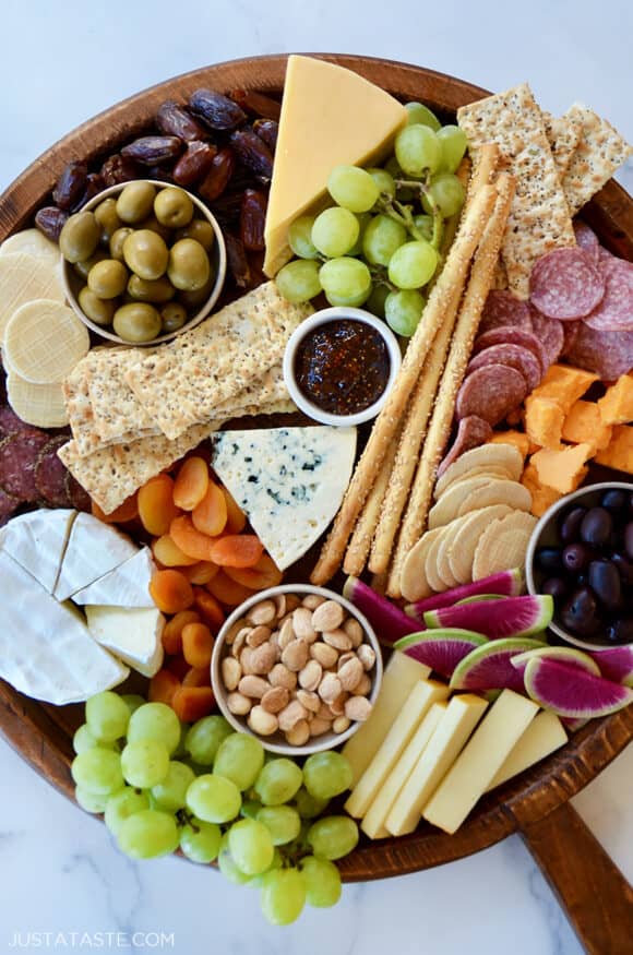 A top down view of the best charcuterie board with cheese, meat and fruit