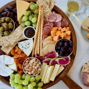 A top-down view of a charcuterie board with various meats and cheeses