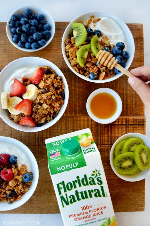 A top-down view of granola parfaits with fruit and yogurt